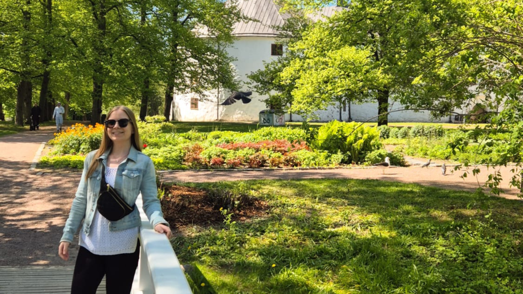 Me standing in front of historic Turku Castle in Finland on a bright summer day.