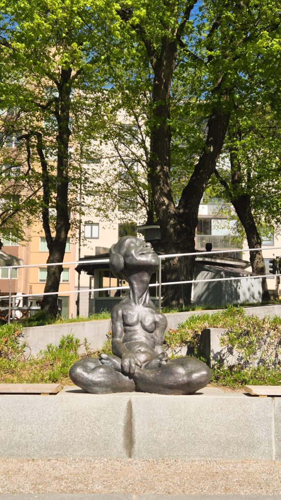 Bronze human sculptures by the Aura River in Turku, Finland.