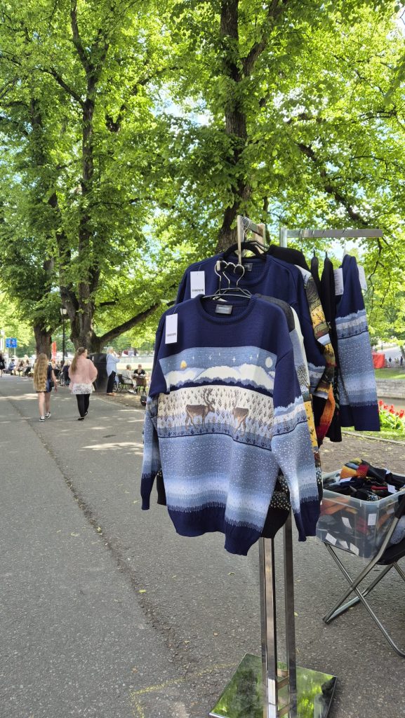 Outdoor summer market in Turku, Finland with colorful stalls and local products.