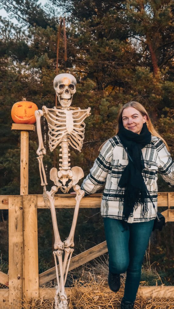 Exploring Salo’s Pumpkin Week festival with Halloween skeleton display.