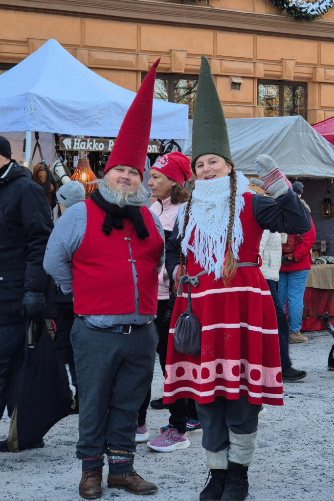 Festive holiday scene at Turku Christmas Market with two elves.