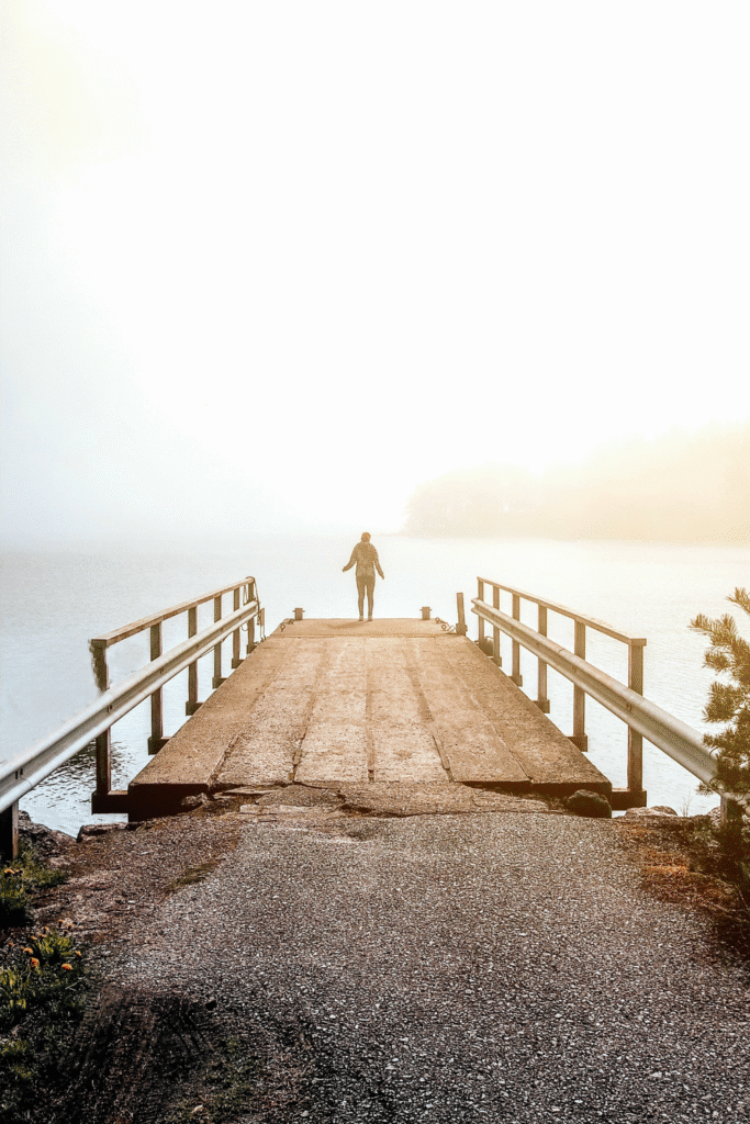 Standing by the sea on a foggy autumn day in Finland.