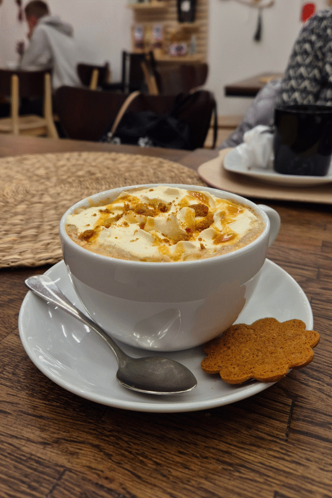 Cozy cafe moment in Finland with gingerbread latte during the cold season.