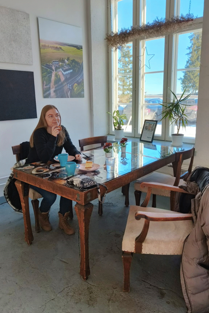 Cozy autumn café in Finland with cinnamon buns and hot coffee.