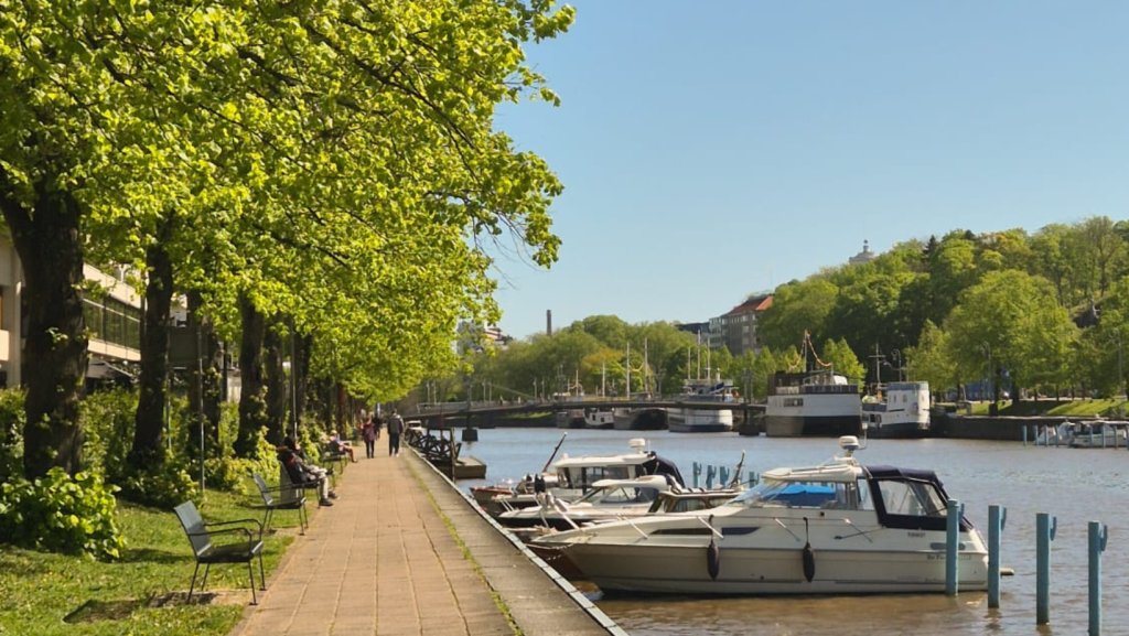 Boats along the Aura River on a sunny summer day in Turku, Southwest Finland. 