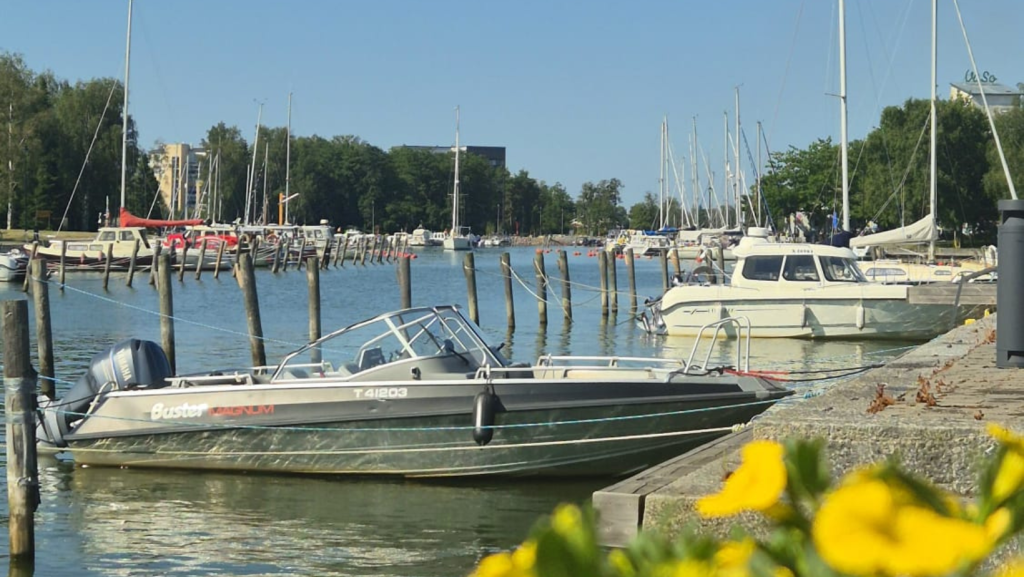 Boats along the waterfront in Uusikaupunki on a sunny summer day in Finland.