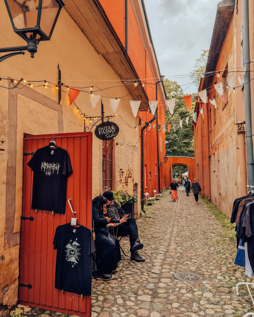Historic wooden buildings on Luostarin Välikatu in Turku on a sunny summer day.