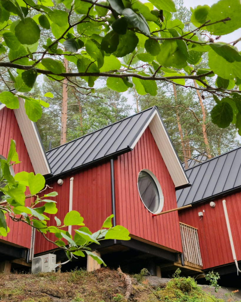 Unique red birdhouse stays at Herrankukkaro in Southwest Finland.