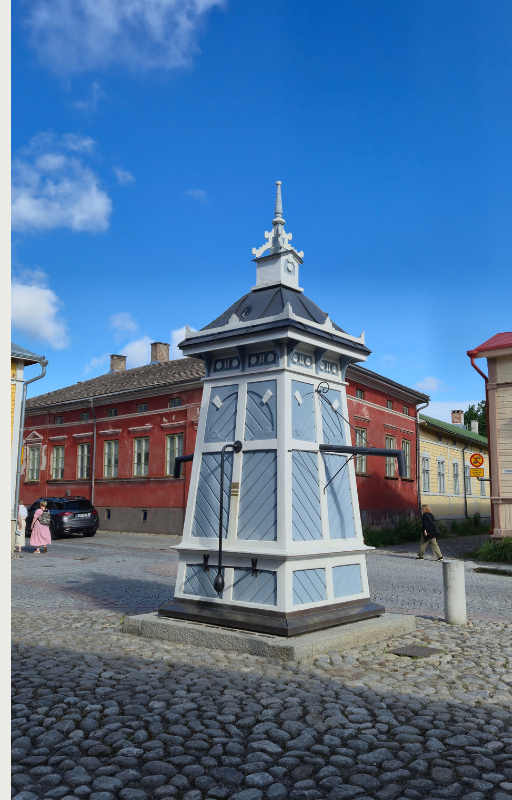 Historic wooden houses in Old Rauma, Finland, on a sunny summer day. 