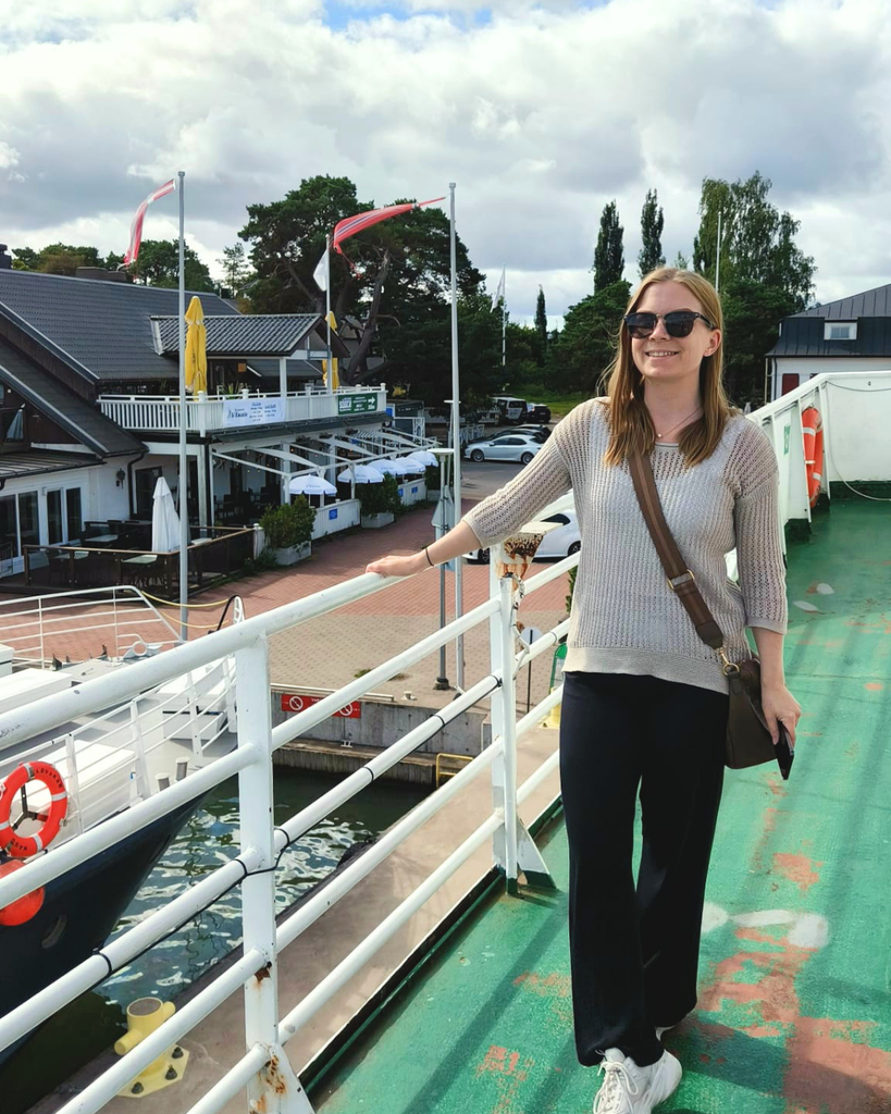 Woman standing on the deck of a boat to Seili Island in the Finnish Archipelago.