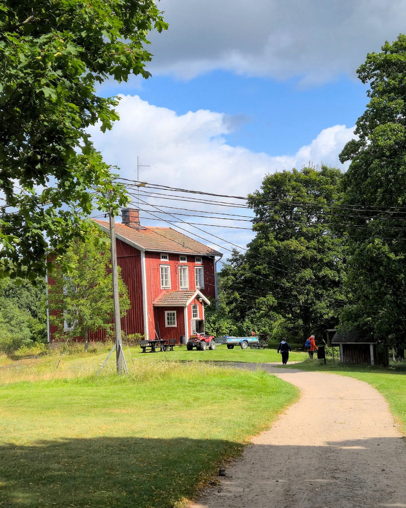 Red wooden house on Seili Island in the Finnish Archipelago on a sunny summer day.