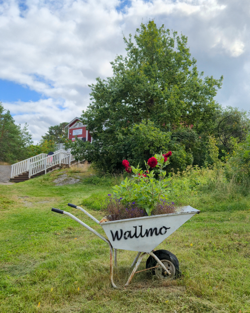 Exterior of Wallmo, a local shop in Nauvo, Finland, with its outdoor surroundings