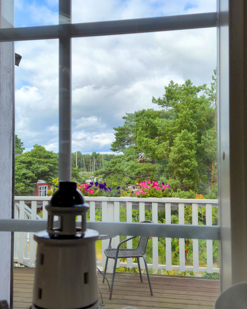 View of Nauvo harbour and surroundings through the window of a local shop.
