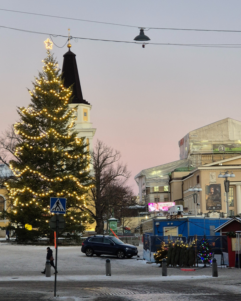 Christmas market in Tampere, Finland, with a festive Christmas tree and seasonal decorations.