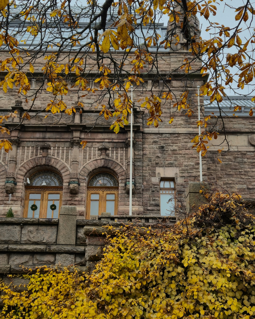 Turku Art Museum exterior surrounded by colorful autumn foliage in Turku, Finland.