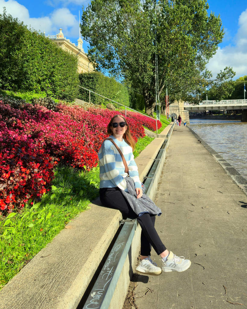 A local enjoying a sunny summer day by the Aura River in Turku, Finland, near the city’s museums and riverside attractions.